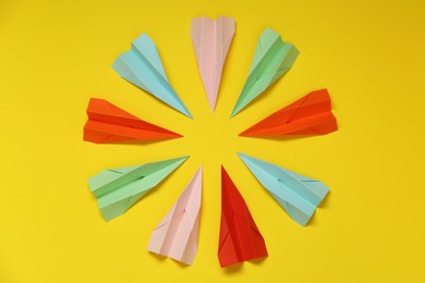 Photo of Flat lay composition with different paper planes on yellow background