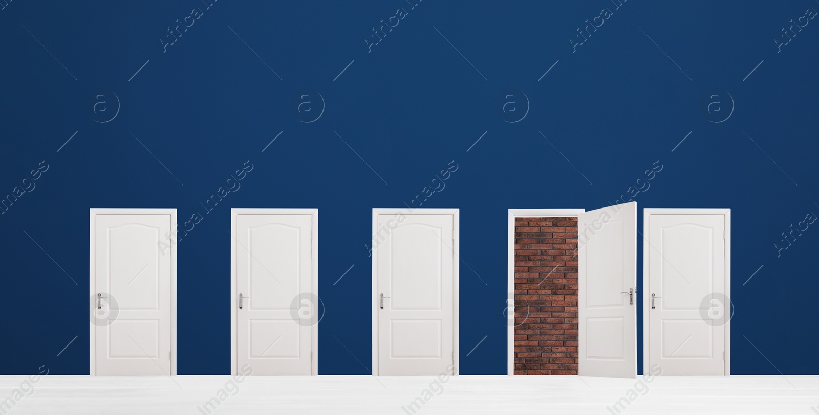 Image of Many white doors in room. Concept of choice