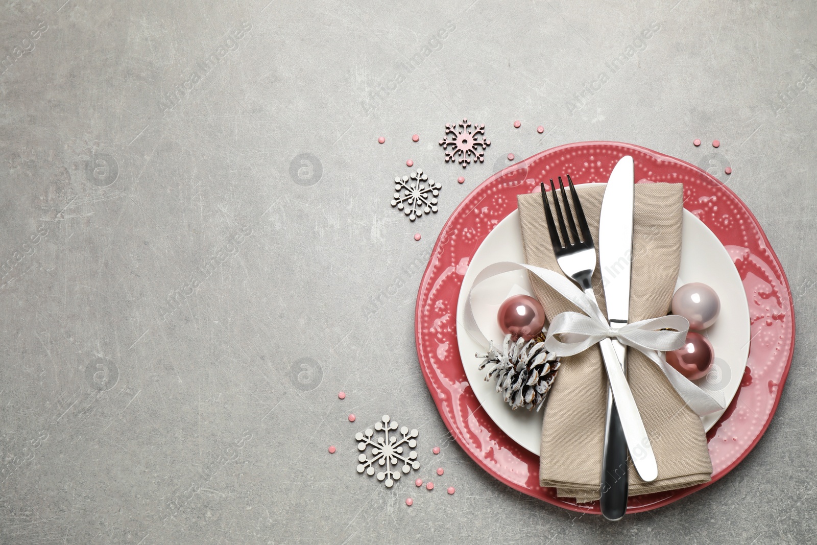 Photo of Festive table setting with beautiful dishware and Christmas decor on grey background, flat lay. Space for text