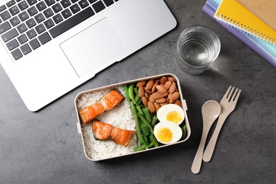 Photo of Flat lay composition with container of natural protein food on office table