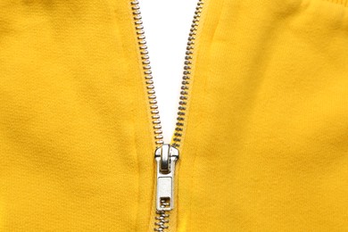 Photo of Yellow sweatshirt with zipper as background, top view