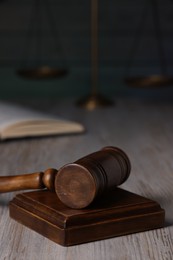 Photo of Law concept. Judge's gavel on light wooden table, closeup