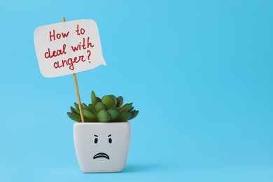 Photo of Potted houseplant with unhappy face and speech bubble saying How To Deal With Anger? on light blue background. Space for text