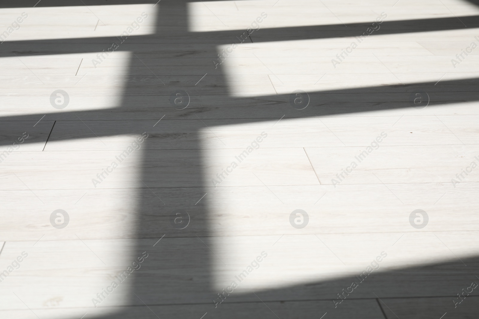 Photo of Shadow from window on white laminated floor indoors