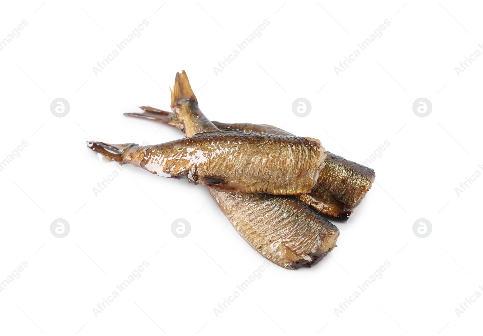 Photo of Many tasty smoked sprats isolated on white