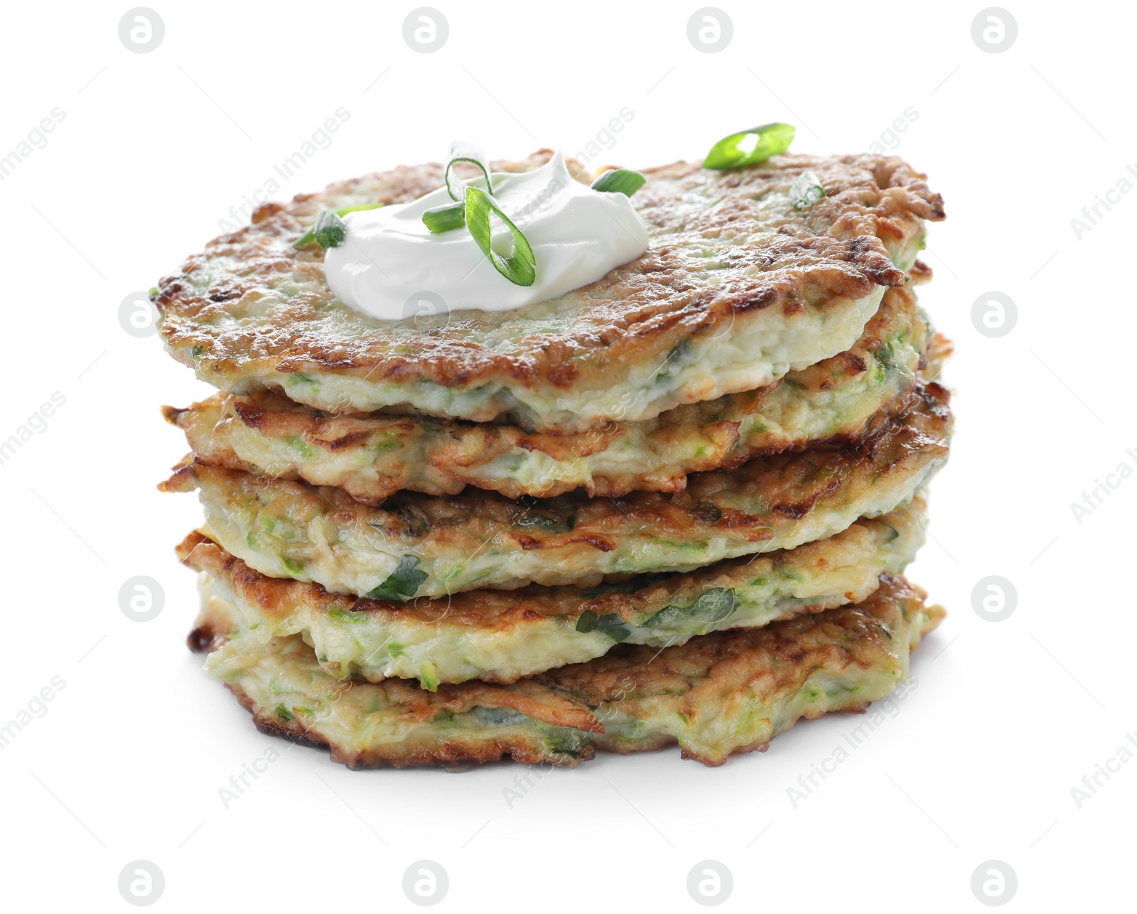 Photo of Stack of delicious zucchini fritters with sour cream and green onion on white background