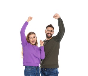 Photo of Happy young people celebrating victory on white background