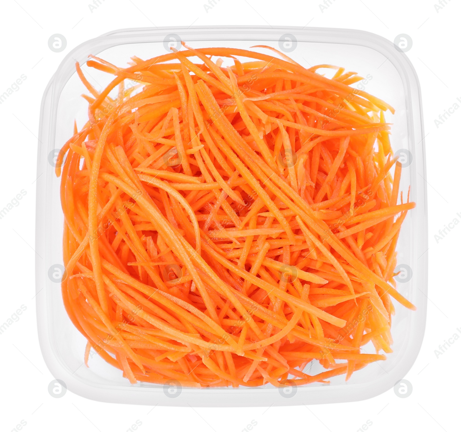 Photo of Fresh shredded carrots in plastic container isolated on white, top view