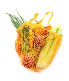 String bag with vegetables and fruits isolated on white, top view