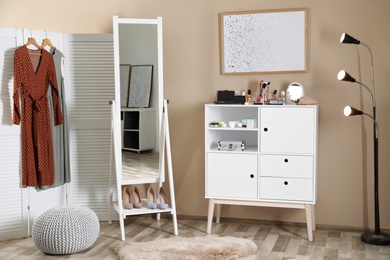 Photo of Interior of beautiful room with dressing table near wall