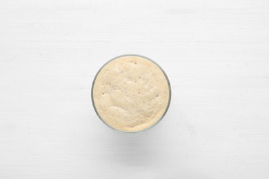 Photo of Leaven on white wooden table, top view
