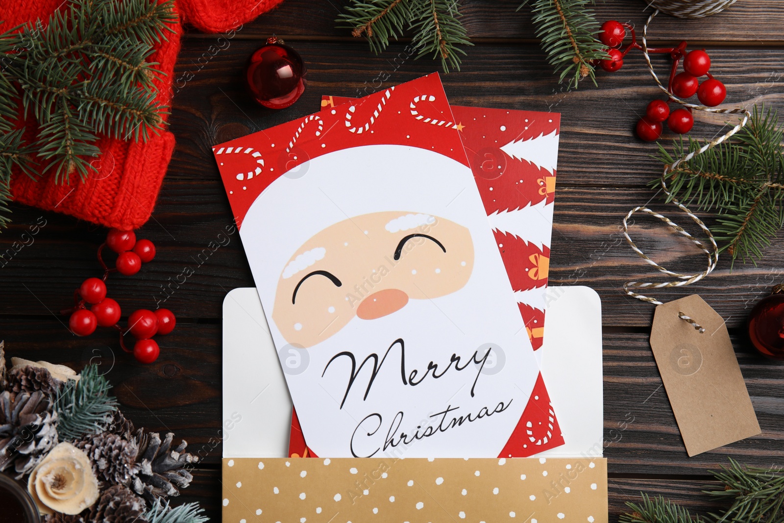 Photo of Flat lay composition with Christmas cards on wooden background