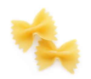 Photo of Uncooked farfalle pasta on white background, top view