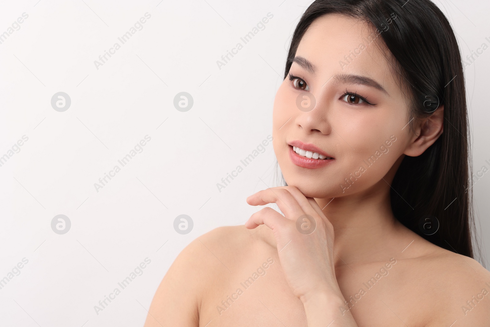 Photo of Portrait of beautiful woman on white background