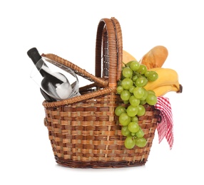 Photo of Wicker basket for picnic filled with food on white background