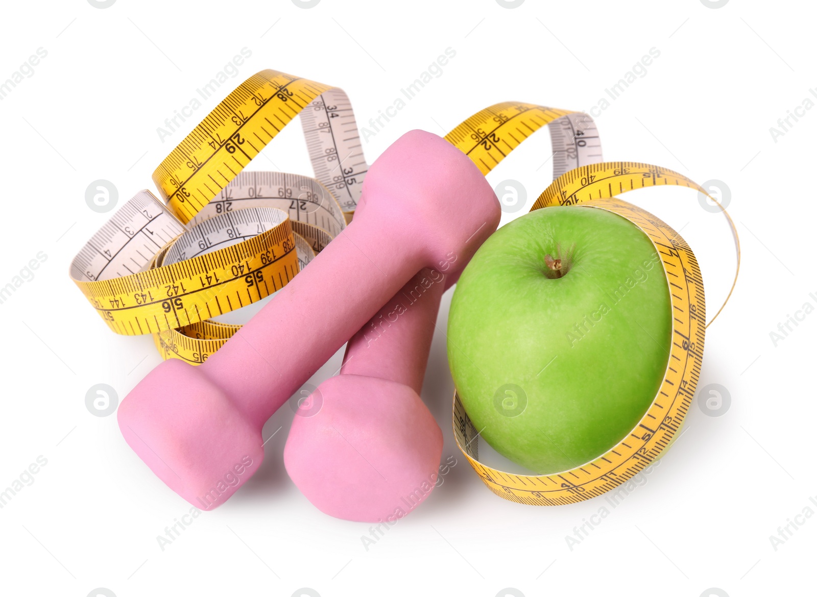 Photo of Dumbbells, apple and measuring tape isolated on white