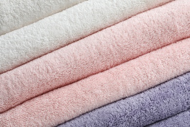 Stack of fresh soft towels as background