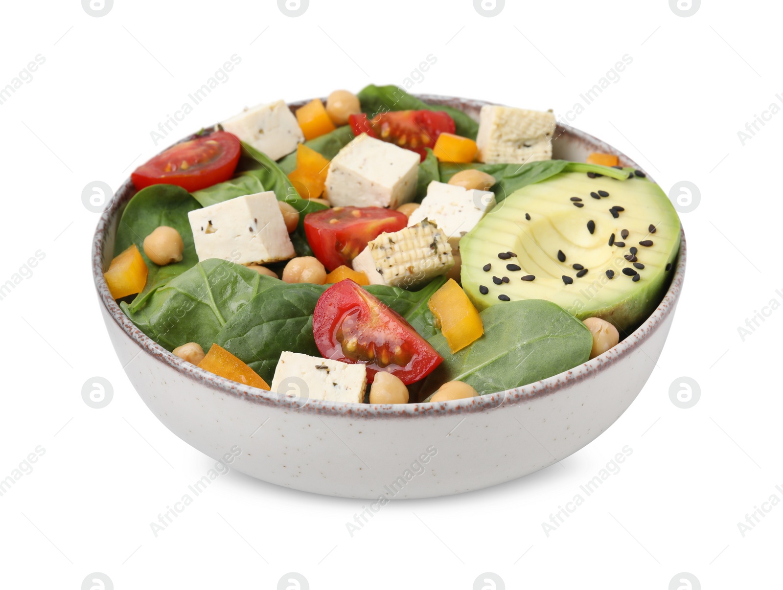 Photo of Bowl of tasty salad with tofu and vegetables isolated on white