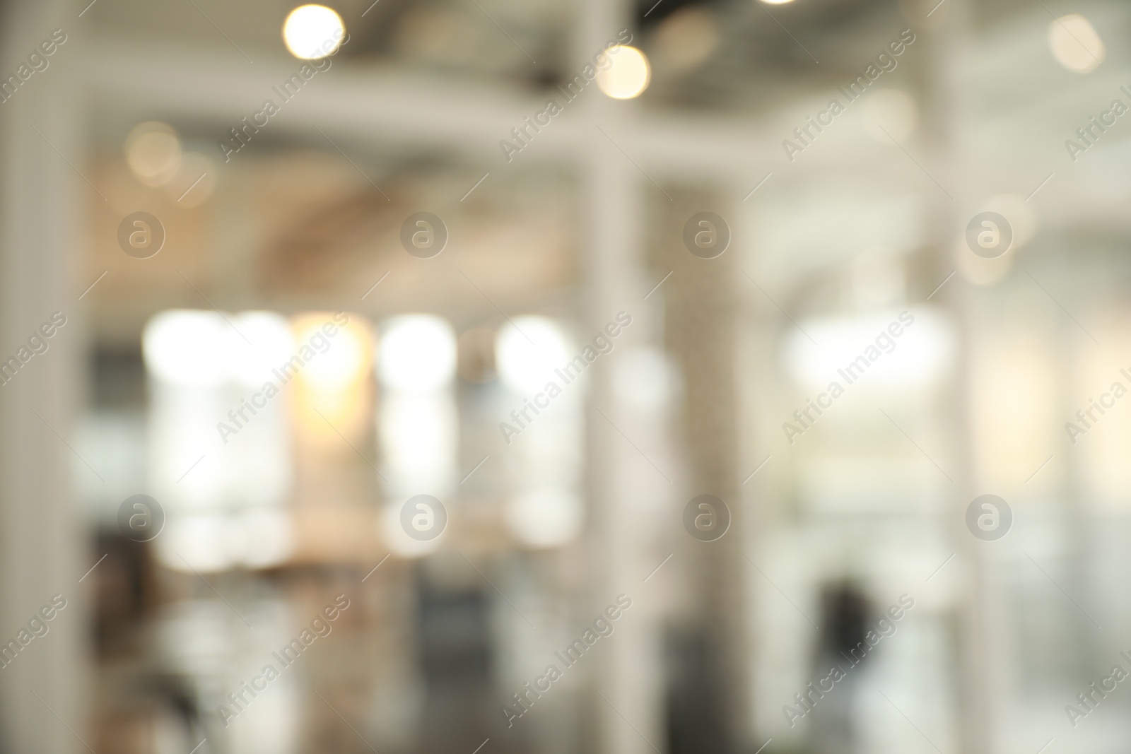 Photo of Blurred view of empty corridor with glass door in company