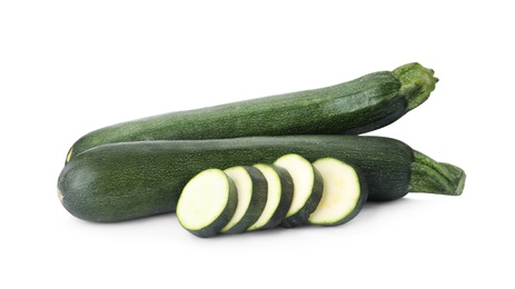 Photo of Cut and whole green ripe zucchini isolated on white