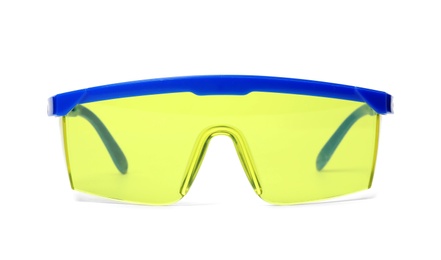 Photo of Protective goggles on white background. Construction tool