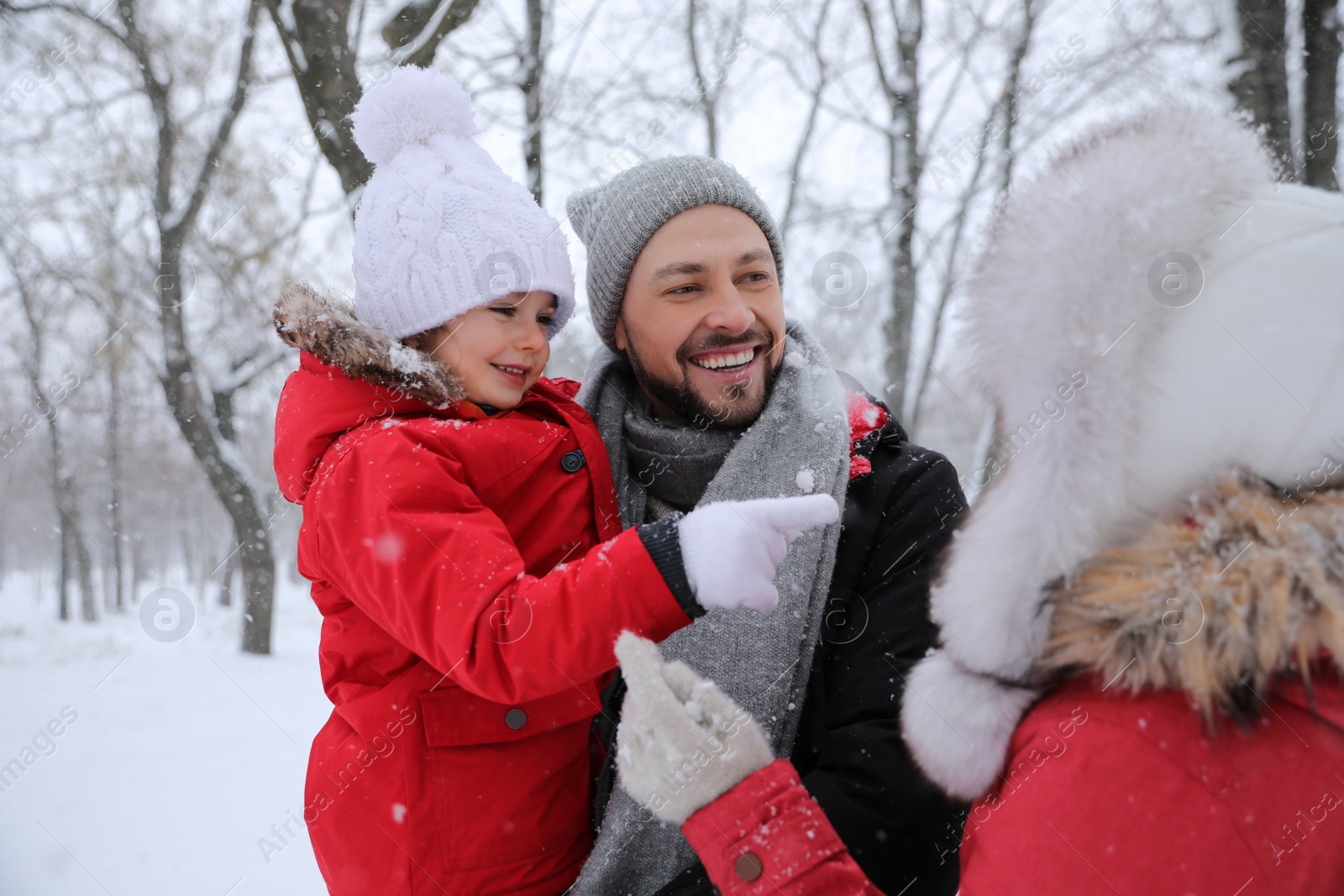 Photo of Family spending time outside on winter day. Christmas vacation