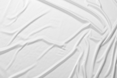 Photo of Texture of white silk ripple fabric as background, top view