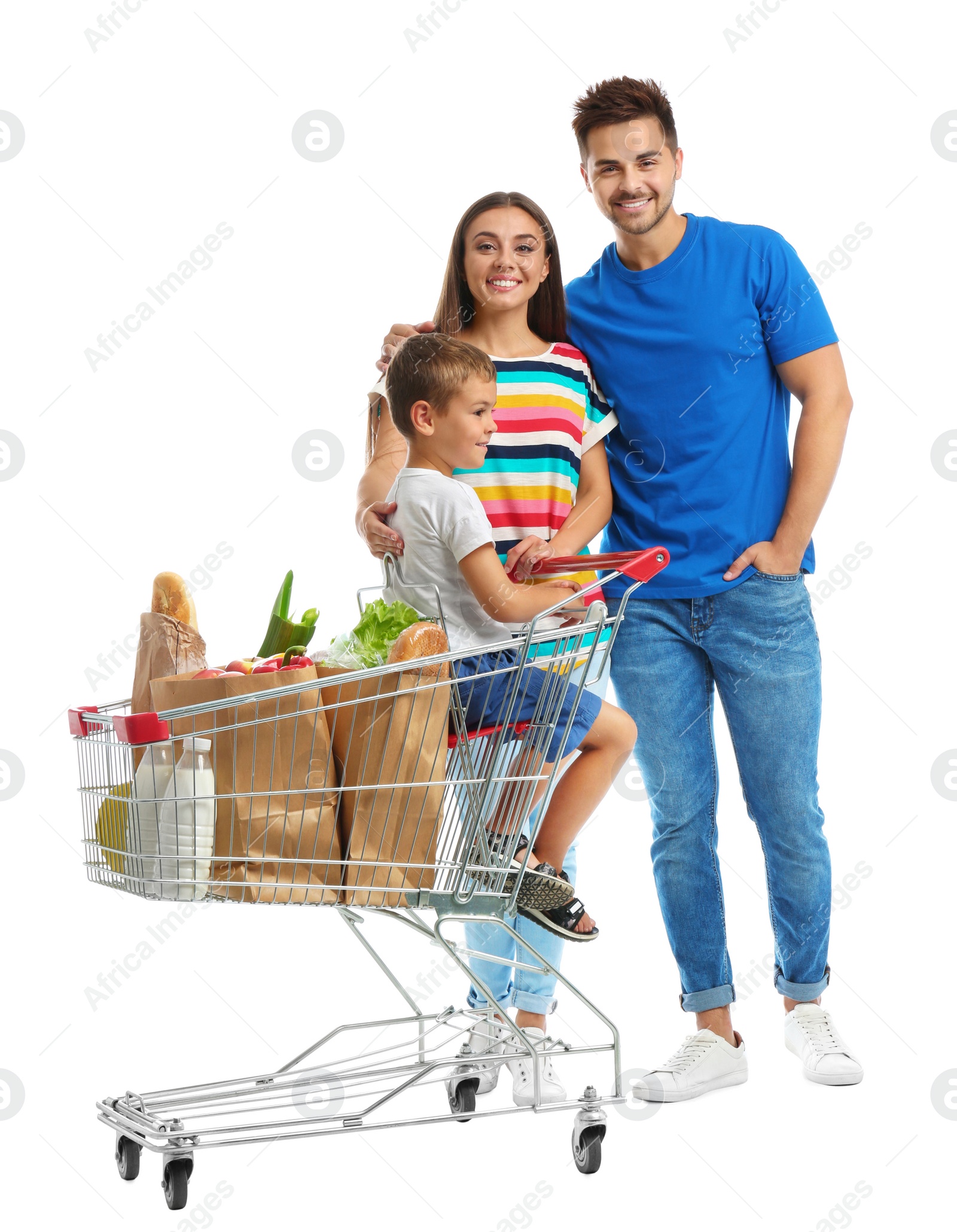 Photo of Happy family with shopping cart on white background