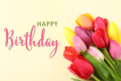 Image of Happy Birthday! Beautiful tulips on beige background, top view 
