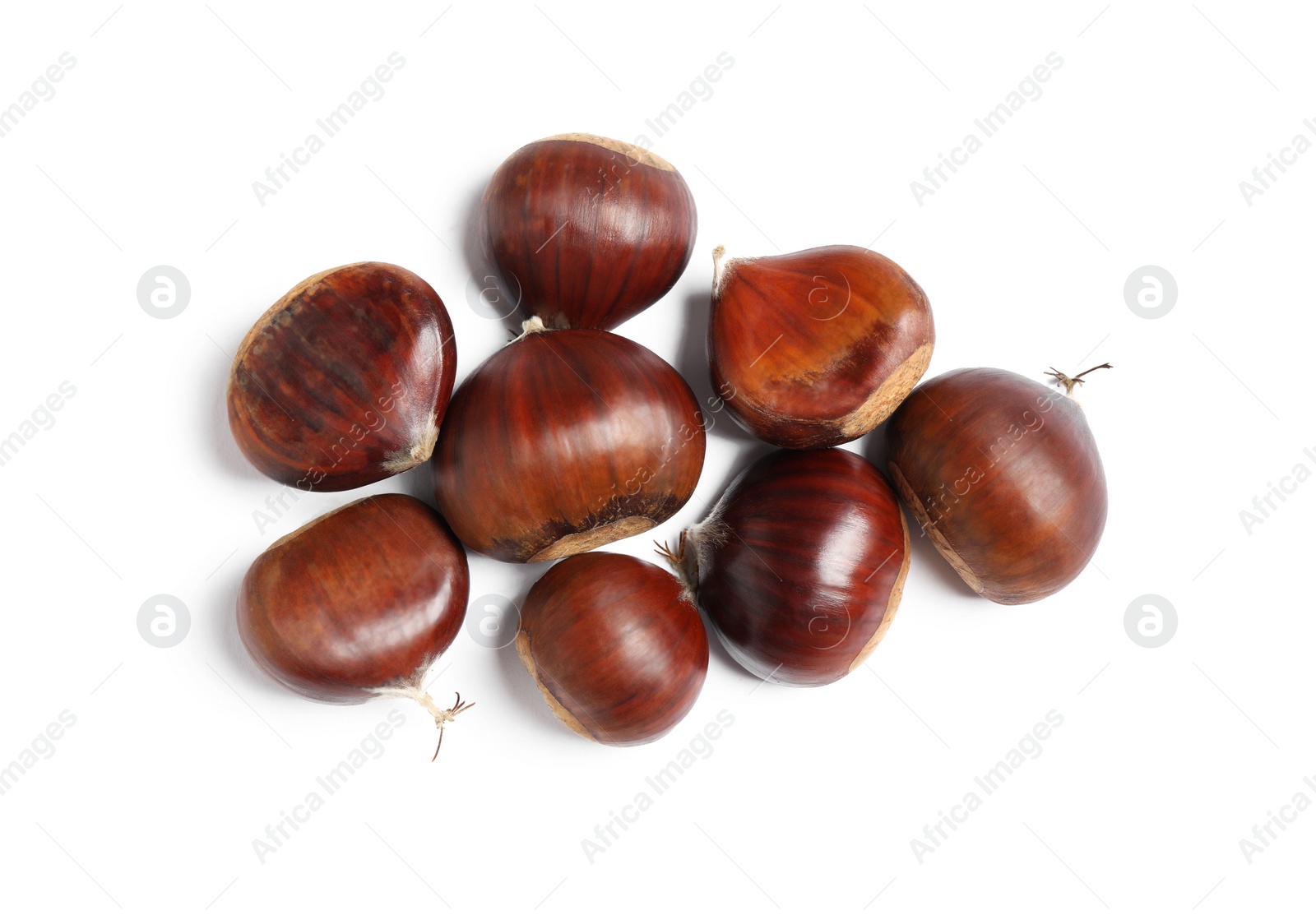 Photo of Fresh sweet edible chestnuts on white background, top view