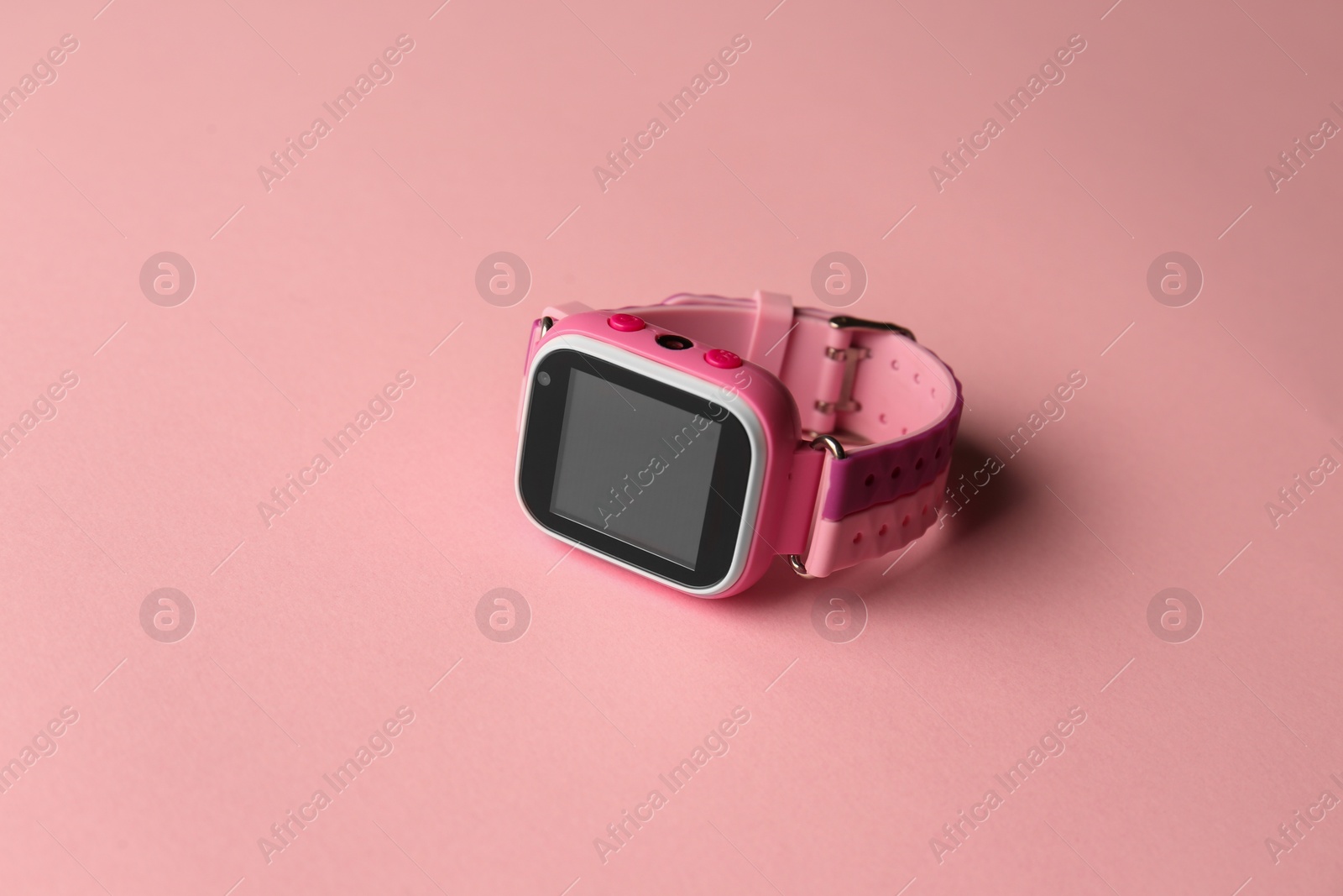 Photo of Modern trendy smart watch for kids on pink background