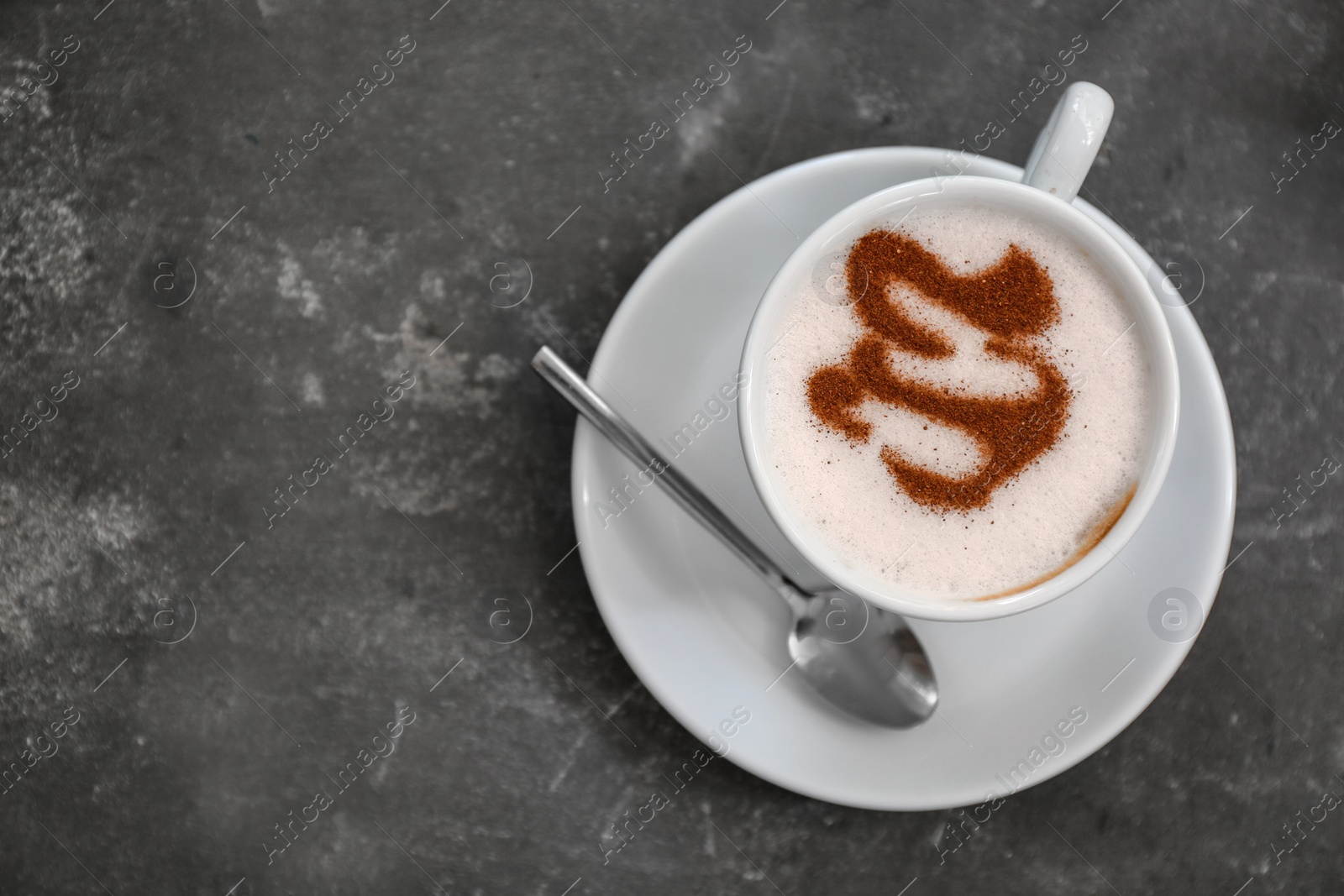 Photo of Cup of fresh aromatic coffee on grey background, top view