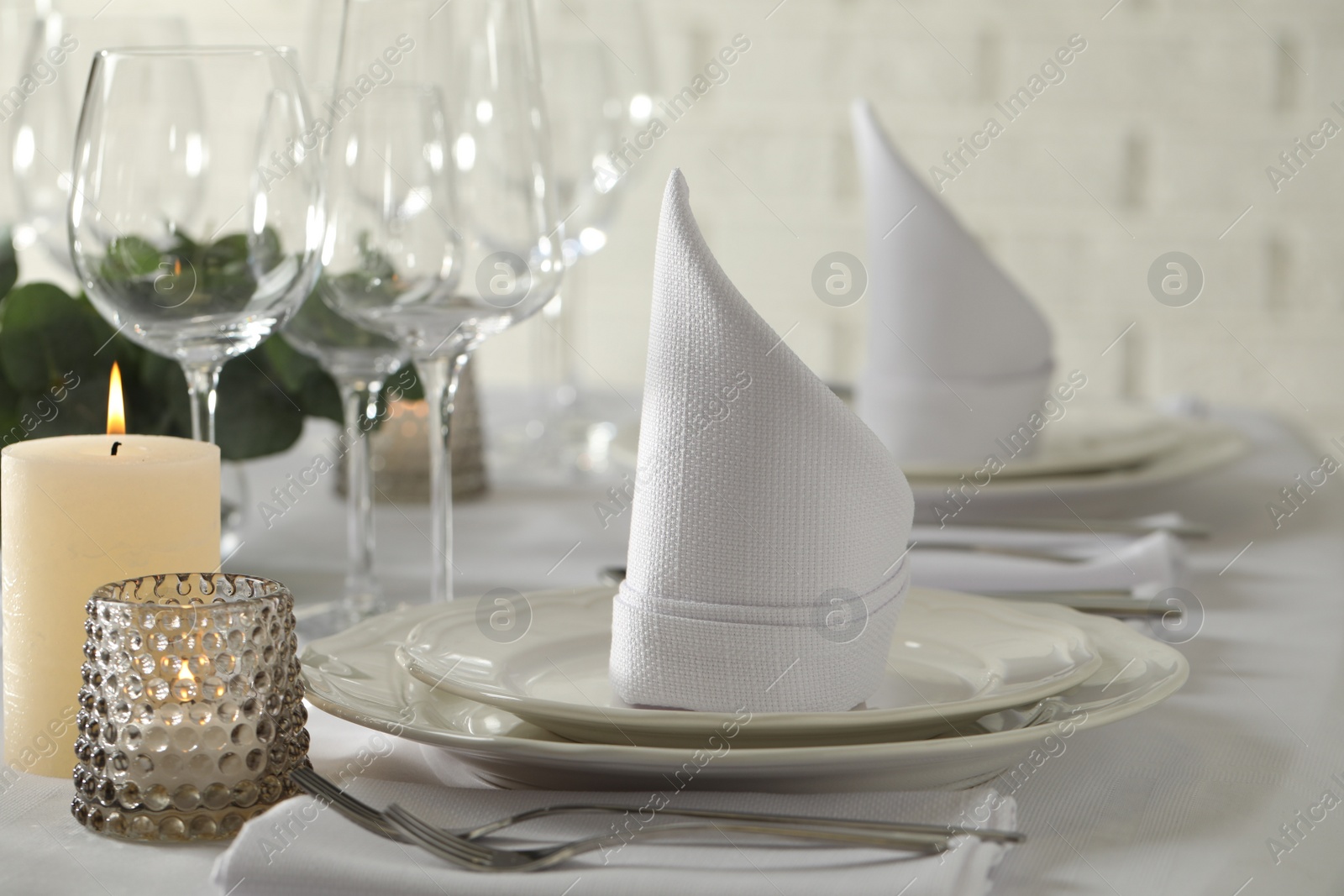 Photo of Stylish elegant table setting for festive dinner in restaurant