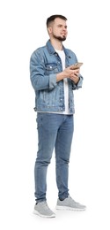 Photo of Man in denim clothes using mobile phone on white background