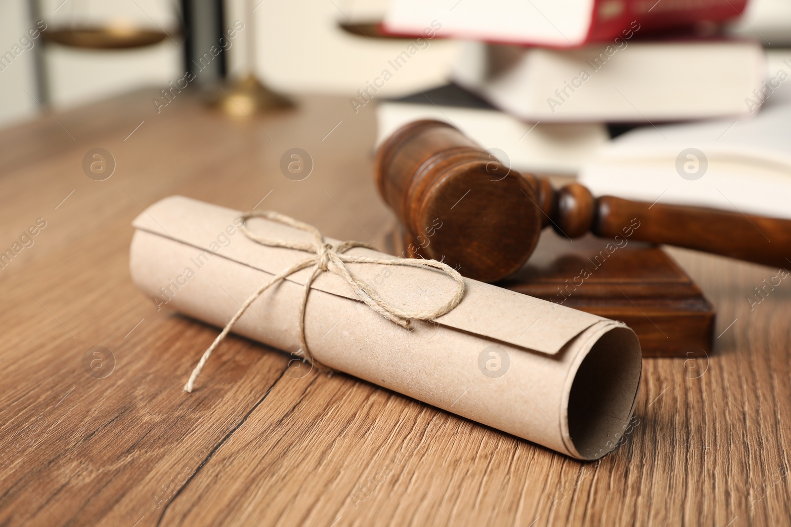 Photo of Document and gavel on wooden table, closeup. Notary contract