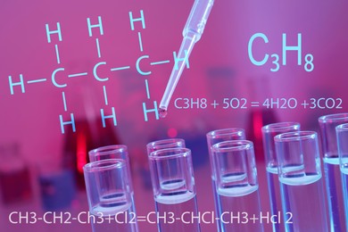 Dripping reagent into test tube with liquid, closeup