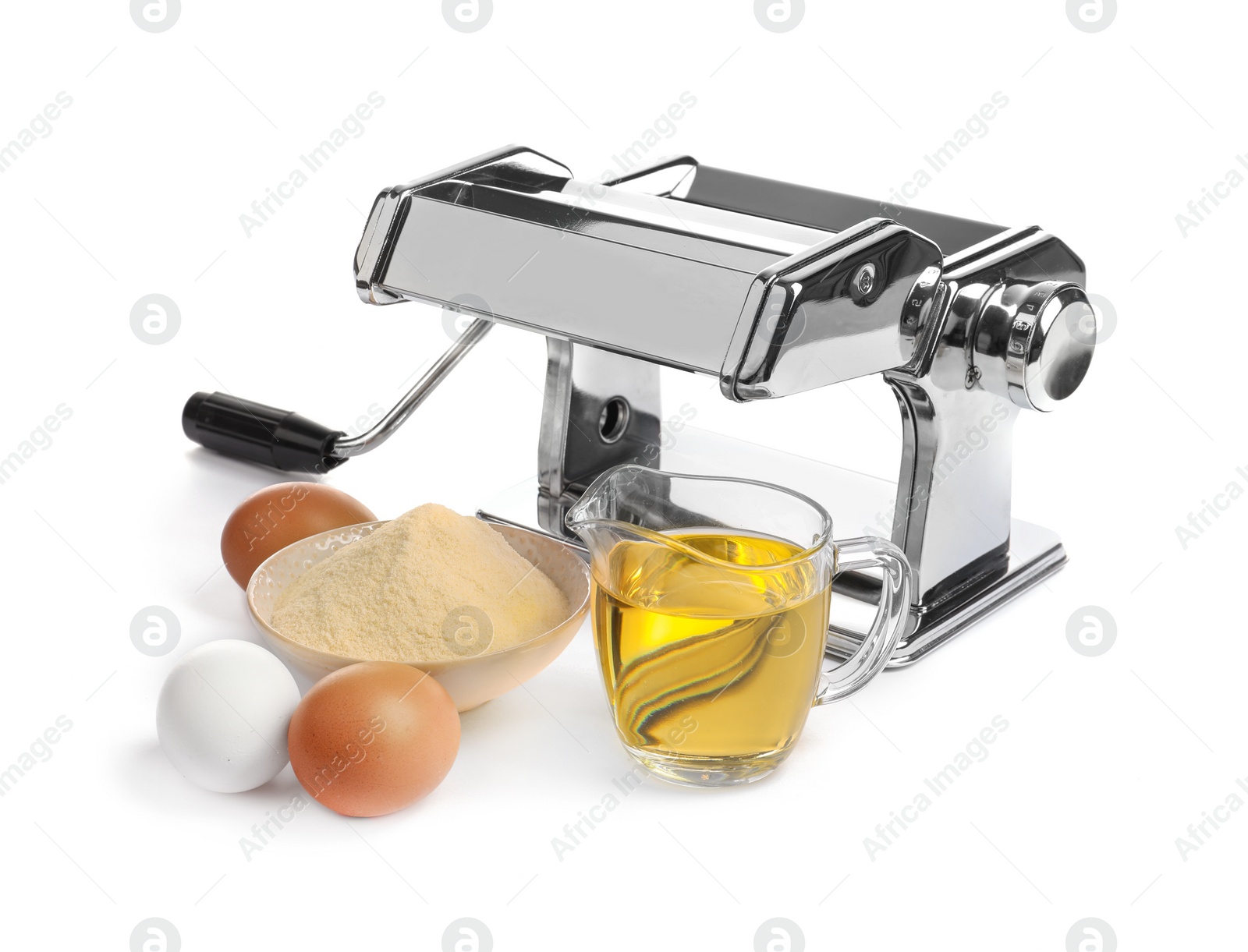 Photo of New pasta machine and products on white background