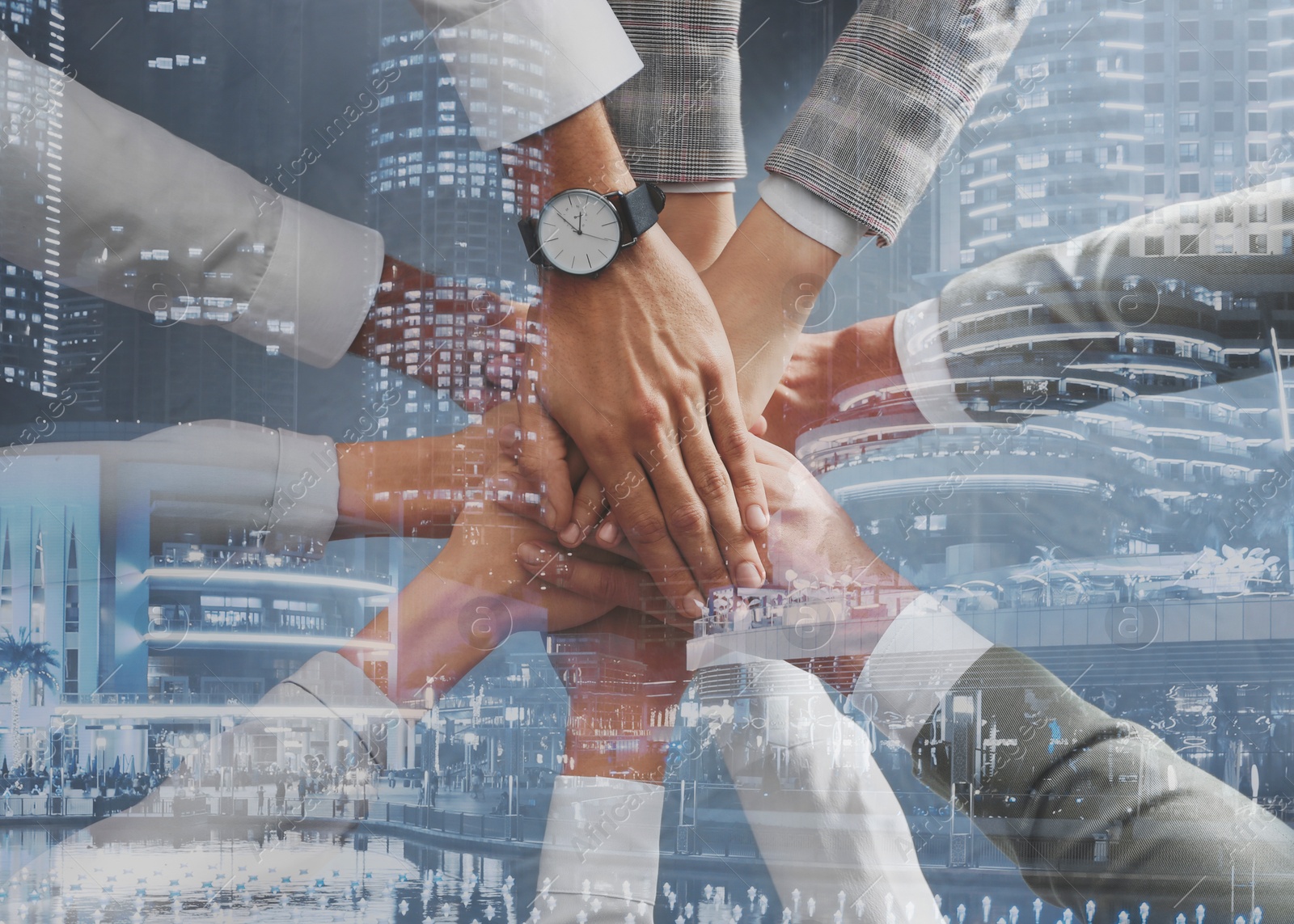 Image of Partnership concept. Double exposure of people joining hands together and night cityscape