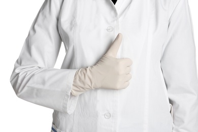 Photo of Doctor in medical glove showing thumb-up gesture on white background
