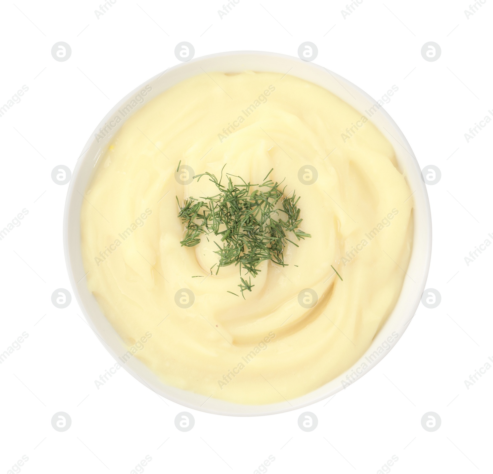 Photo of Bowl of tasty cream soup with dill isolated on white, top view