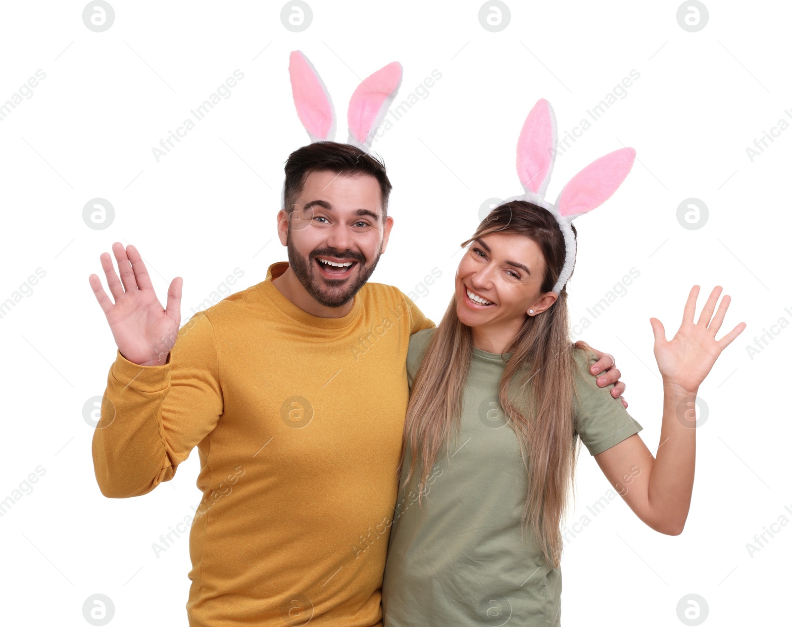 Photo of Easter celebration. Happy couple with bunny ears isolated on white