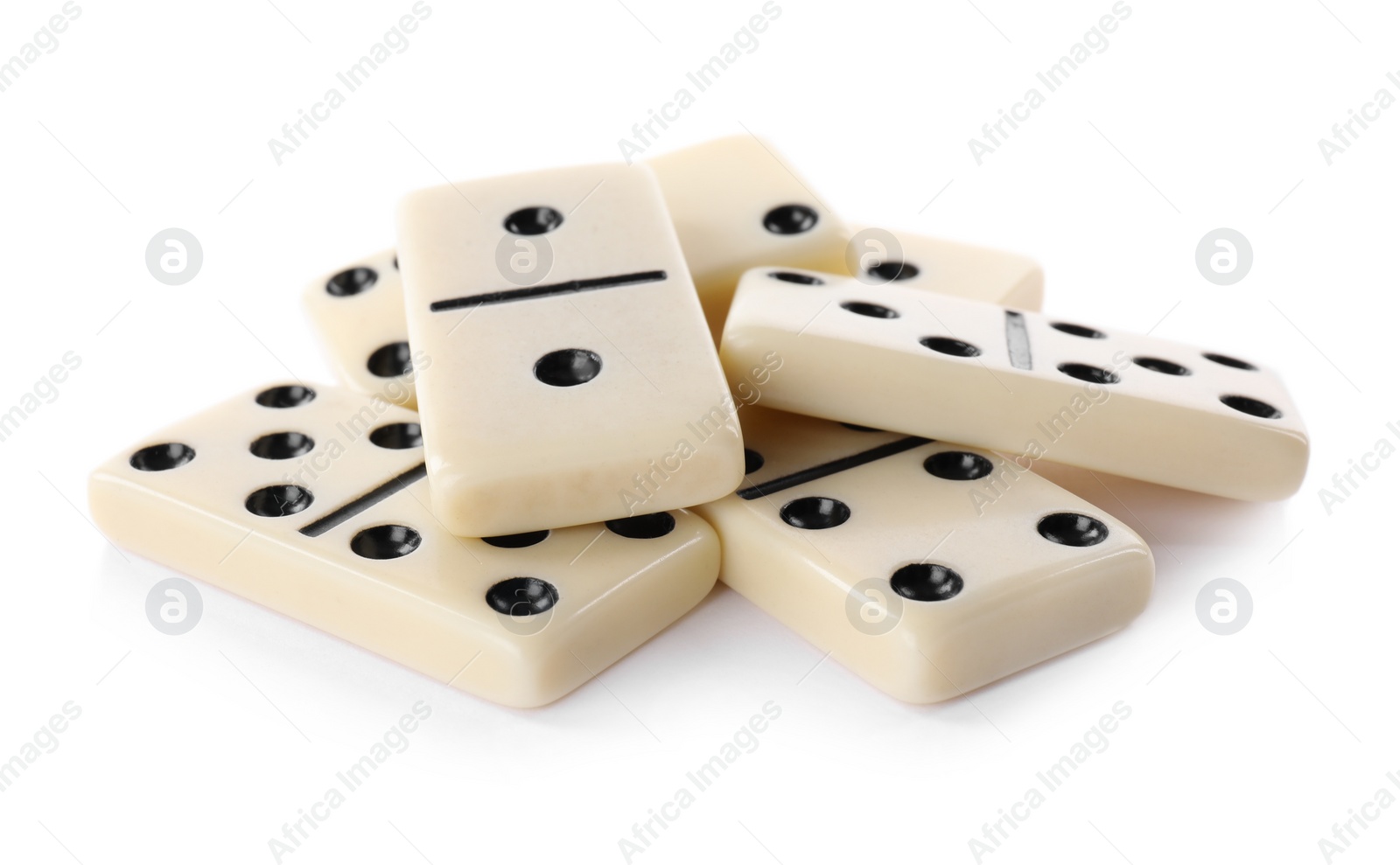 Photo of Pile of classic domino tiles on white background