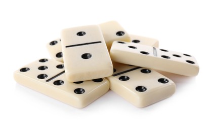 Photo of Pile of classic domino tiles on white background