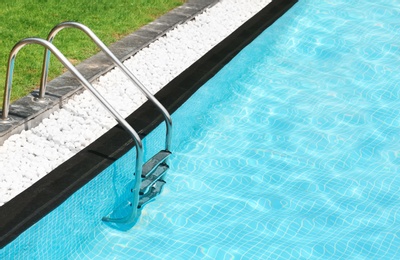 Modern swimming pool with stairs at resort