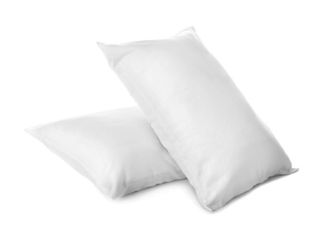 Clean soft bed pillows on white background