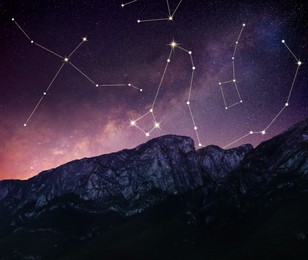 Image of Different constellations in starry sky over mountains at night