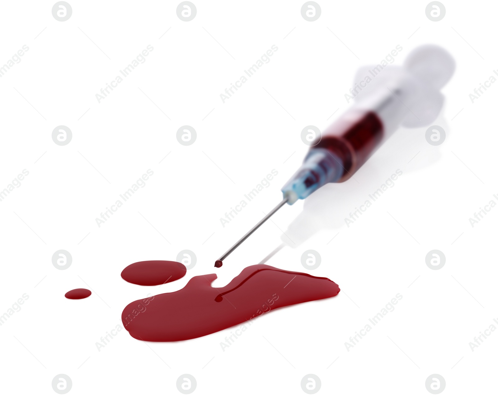 Photo of Plastic syringe with blood on white background