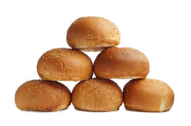 Photo of Stack of fresh tasty buns with sesame seeds isolated on white