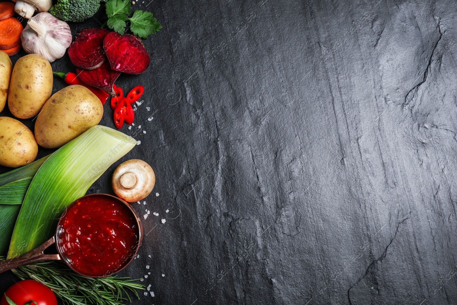 Photo of Flat lay composition with fresh products on grey table, space for text. Healthy cooking