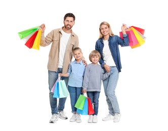 Family shopping. Happy parents and children with many colorful bags on white background